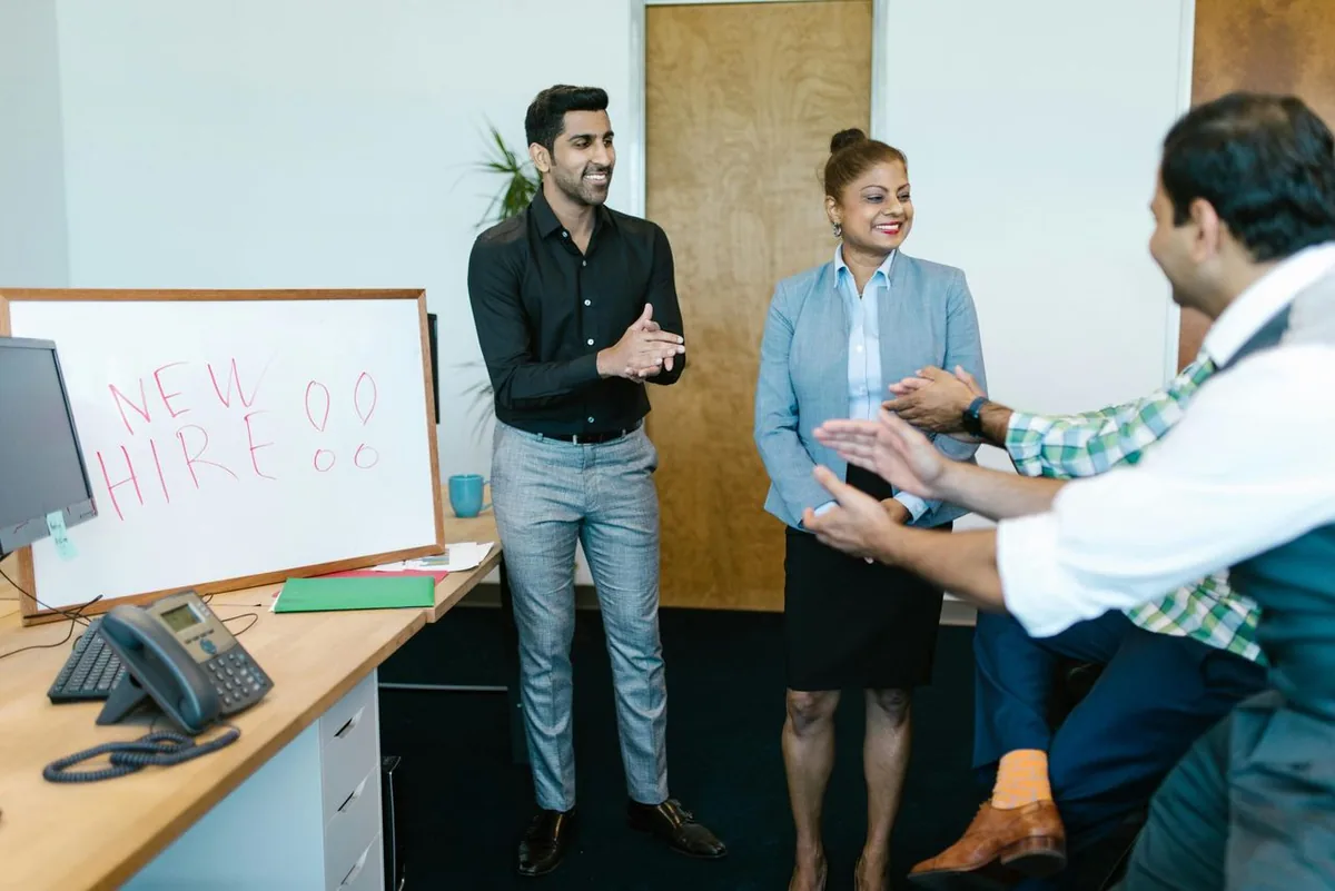 Diverse professionals collaborating under HireRarity LGBTQI+ hiring initiative